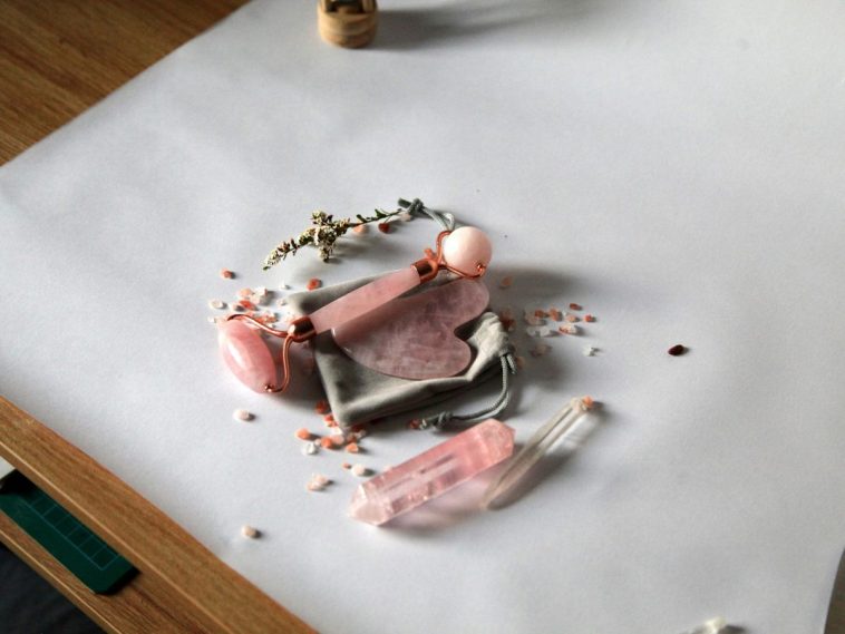 rose quartz bracelet on table